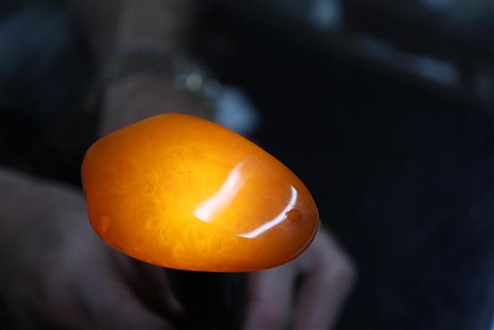 An amber pebble pendant, gross weight 22grams, 59mm.